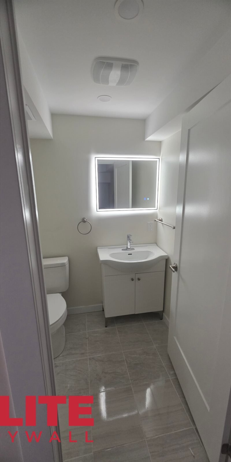 Finished bathroom after drywall finishing and painting