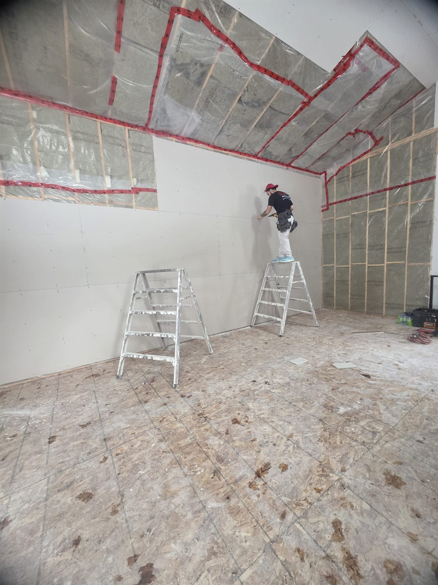 Elite Drywall specialist installing drywall