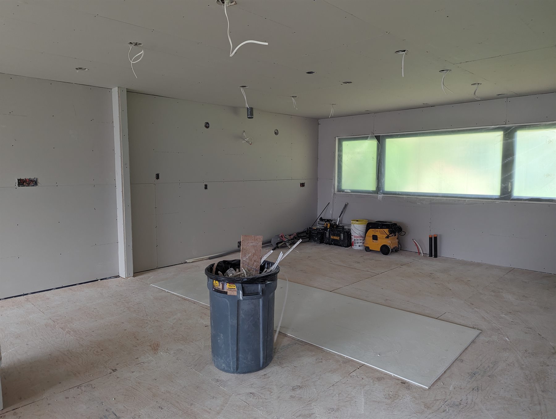 Drywall installation in progress inside a residential renovation